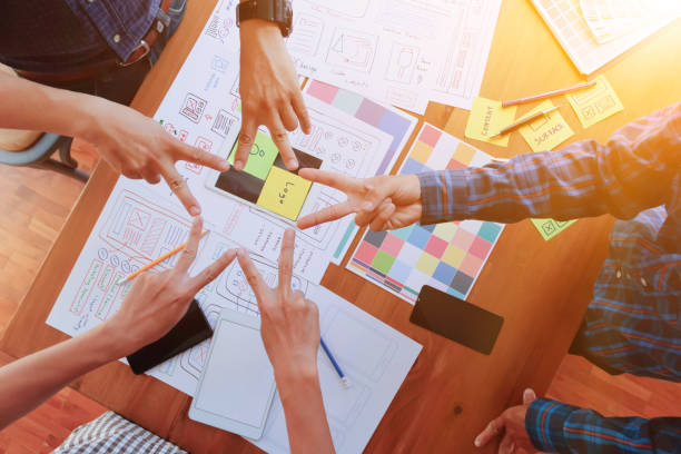 Smooth Focus, group of web designers are working together to develop mobile responsive website with UI UX Front End Designer Previewing. website designers in form of mobile applications with UI UX